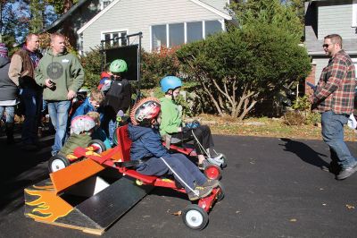 Soapbox Derby
Marion and Rochester Cub Scouts came together on November 6 for a soapbox derby on Holmes Street in Marion. The longtime fundraising event was not held in 2020 due to the coronavirus pandemic but made a roaring return on Saturday, as children raced their homemade go-carts and collected donations for the Murphy and Others, Living Interdependently for Future Endeavors, Inc. (M.O. L.I.F.E.) non-profit food pantry in Fairhaven. Photos by Mick Colageo and Reade Whinnem
