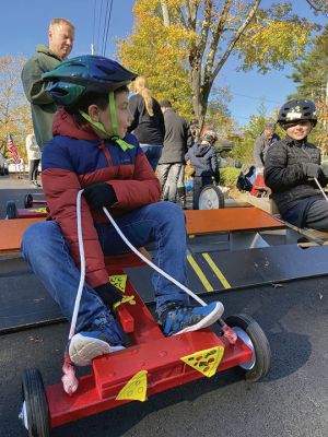 Soapbox Derby
Marion and Rochester Cub Scouts came together on November 6 for a soapbox derby on Holmes Street in Marion. The longtime fundraising event was not held in 2020 due to the coronavirus pandemic but made a roaring return on Saturday, as children raced their homemade go-carts and collected donations for the Murphy and Others, Living Interdependently for Future Endeavors, Inc. (M.O. L.I.F.E.) non-profit food pantry in Fairhaven. Photos by Mick Colageo and Reade Whinnem
