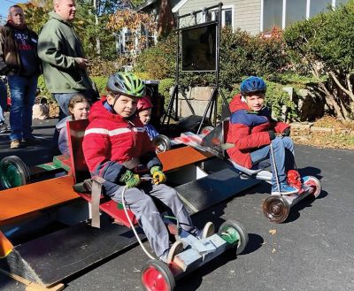 Soapbox Derby
Marion and Rochester Cub Scouts came together on November 6 for a soapbox derby on Holmes Street in Marion. The longtime fundraising event was not held in 2020 due to the coronavirus pandemic but made a roaring return on Saturday, as children raced their homemade go-carts and collected donations for the Murphy and Others, Living Interdependently for Future Endeavors, Inc. (M.O. L.I.F.E.) non-profit food pantry in Fairhaven. Photos by Mick Colageo and Reade Whinnem
