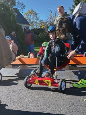 Soapbox Derby
Marion and Rochester Cub Scouts came together on November 6 for a soapbox derby on Holmes Street in Marion. The longtime fundraising event was not held in 2020 due to the coronavirus pandemic but made a roaring return on Saturday, as children raced their homemade go-carts and collected donations for the Murphy and Others, Living Interdependently for Future Endeavors, Inc. (M.O. L.I.F.E.) non-profit food pantry in Fairhaven. Photos by Mick Colageo and Reade Whinnem
Keywords: Soapbox Derby