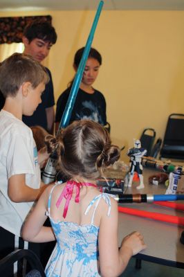 Star Wars Fans
Local young Star Wars fans gathered in Rochester at the Congregational Church on July 18 for a Star Wars symposium, hosted by Star Wars expert Peter Struzziero and sponsored by the Plumb Library. Pictured in descending order left to right: Dylan Hathaway, Bridget Farias, Ryan Farias, Andrew Ronsky, Molly Ronsky, Jack Ronsky, Nicholas Miedemar, and Rebecca York. Photo by Jean Perry
