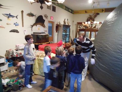 Starlab
The Marion Natural History Museum's afterschool program learned about some of our winter constellations on Wednesday February 29th.  Newly trained Starlab presenter Bob Munroe read a Native American story about the stars and the participants used a pointer to find the most familiar of the constellations. Photo courtesy of Elizabeth Leidhold
