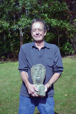 Stone Cold Spooky 
Mattapoisett resident Warren Parsons says this pre-colonial stone head his grandmother found on the old family farm in Dartmouth back in the ‘50s is haunted or maybe even cursed. Should we take Parsons’ word for granite? The stone head seemed gneiss to us. (See what we did there?) Photo by Jean Perry


