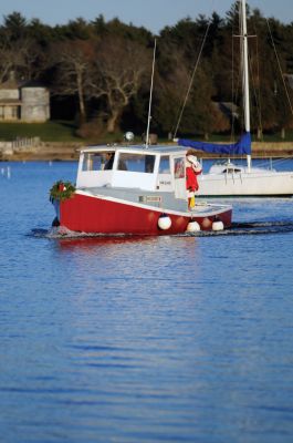 Ahoy Santa!
The annual Marion Holiday Stroll took place on Sunday, December 11, 2011. As usual, Santa arrived at Barden's Boatyard on Front Street and with the help of the Sippican School Cottage Street Jam Band, led the Stroll to the Bicentennial Park for a tree lighting. Photo by Felix Perez. December 15, 2011 edition
