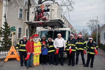 Marion Holiday Stroll
The Marion Fire Department poses with Sparky the Dog before the Marion Holiday Stroll gets underway on Sunday, December 9.  Photo by Eric Tripoli.
