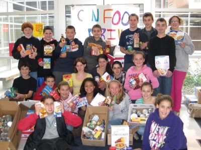 Food Donations
The ORR Junior High School Student Affairs Committee collected more than 1,000 food items that were donated to the food pantry at St. Anthonys Parish in Mattapoisett. Photo courtesy of Nancy Moura. 
