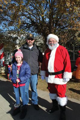 Stuff a Cruiser
Willie enjoys a moment with the 1924 Model T, and Santa Claus is joined by Marion Chief of Police Richard Nighelli and his daughter Kayla as the Marion Police Department and Marion Police Brotherhood collaborated for their annual Stuff a Cruiser event at the Sippican Elementary School’s bus loop. 
