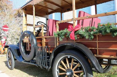 Stuff a Cruiser
Willie enjoys a moment with the 1924 Model T, and Santa Claus is joined by Marion Chief of Police Richard Nighelli and his daughter Kayla as the Marion Police Department and Marion Police Brotherhood collaborated for their annual Stuff a Cruiser event at the Sippican Elementary School’s bus loop. 
