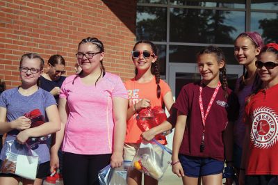 Stayin’ Alive 
Survival Week at ORR Junior High kicked off on the early morning of Sunday, June 17, as the 7th-graders boarded the busses for Western Massachusetts for a week of roughing it in the wild. And for this generation, that simply means no electronic devices and no Dunkin’ Donuts. Survival is now in its 46th year and still going strong. Some, like Survival leader Kevin “KT the Kilt Man” Thompson, have attended Survival since they were 7th-graders 30 years ago. Photos by Jean Perry
