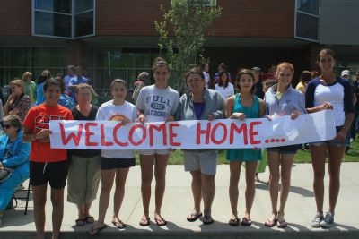 Survival
From left: Kate Martin, Bonnie Goguen, Arden Goguen, Annie Martin, Kim Goguen, Sandy Decas, Emma Downs and Tess Martin hold a sign as they await the arrival of the Survival students on Saturday at ORRJHS.  Photo by Katy Fitzpatrick.
