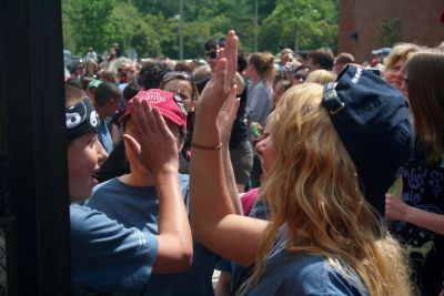 Survival
Counselors give the Survival students high-fives as they get off the bus Saturday.  The students spent a week in the wilderness as part of the yearly program.  Photo by Katy Fitzpatrick.
