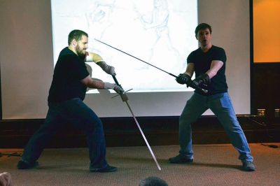 Cold Steel
“Cold Steel” was one of the educating and exciting free programs the Mattapoisett Free Library offers during the summer. Visitors learned all about the history of swords and the origins of sword fighting, while Jeff Lord and Jeff Goodkind from the Association for Renaissance and Medieval Swordsmanship gave live demonstrations before a crowd of enthusiastic kids and adults. Photos by Jean Perry
