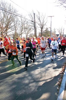 Gobble Gobble Go!
The first annual Marion Recreation Turkey Trot was held on Sunday, November 20, 2011. The winners were: Women's Division, Debe Griesbauer, 41, from Boston, with a running time of 19:19; and Men's Division, Taylor Washburn, 26, of Marion MA, with a running time of 16:42. Photo by Robert Chiarito. November 24, 2011 edition
