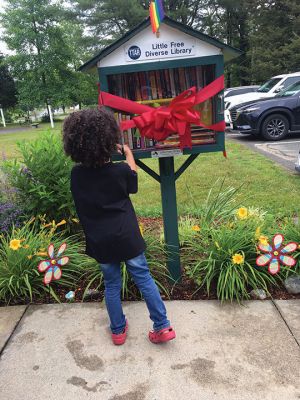 Tri-Town Against Racism
The Town of Rochester received a Little Diverse Free Library on June 17 when members of Tri-Town Against Racism performed a ribbon-cutting and associated Juneteenth celebration at Plumb Library. The ribbon was cut by Owen Excellent, and guest speaker Leon Correy spoke to overcoming struggles and the need for equity for all people. Entertainment was provided by Grace Morrison, and Trevor Brown Jr. spoke on the design of the Juneteenth Flag. Photos by Marilou Newell
