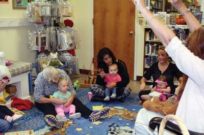 Taber Fall Lapsit Program
The Fall Lapsit Program for babies kicked off on October 7 at the Taber Library in Marion. Babies and their caregivers enjoy 20 minutes of stories and 20 minutes of social time. Children’s Librarian Rosemary Gray delighted five happy babies with some peekaboo, short stories such as Where is Baby’ Belly Button, and songs like the Itsy Bitsy Spider. The program starts at 10:30 am Tuesdays until November 25. Photos by Jean Perry
