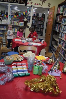 New Year’s Eve
The Taber Library knows that it’s hard for the little ones to stay up until midnight on New Year’s Eve, which is why Children’s Librarian Rosemary Grey hosted a midday mock-midnight New year’s Eve-Day party, complete with party tiaras, horns, snacks, and don’t forget the bubbly apple juice! Photos by Jean Perry
