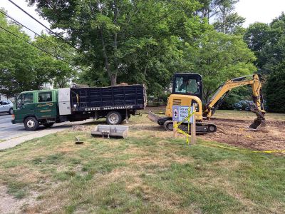 Elizabeth Taber Statue
On July 14, work began on the Elizabeth Taber Statue site at Bicentennial Park in Marion. The site will include granite steppers, concrete paving, lighting, two wooden benches and a granite bench for Elizabeth to sit on. There will be room on either side of the granite bench for folks to sit and thank Elizabeth for all that she did for Marion. Susannah Davis of Marion has designed the plantings that will be added around the site. – Judith Rosbe
