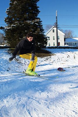 Ski Jumps
Tabor Academy sophomores Andrei Sarbu (yellow pants) and Joe Barry and friends enjoyed their Sunday afternoon, turning the little sledding slope on Spring Street at Tabor Academy’s soccer field into a ski jump. The two 16-year-olds took turns sticking landings from atop roadway barriers. Barry is from Falls Church, Virginia, and Sarbu is a native of Chico, California. Photos by Mick Colageo
