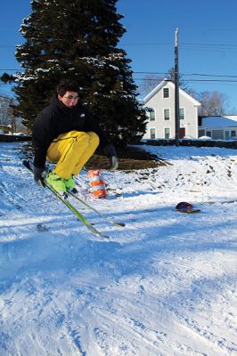 Ski Jumps
Tabor Academy sophomores Andrei Sarbu (yellow pants) and Joe Barry and friends enjoyed their Sunday afternoon, turning the little sledding slope on Spring Street at Tabor Academy’s soccer field into a ski jump. The two 16-year-olds took turns sticking landings from atop roadway barriers. Barry is from Falls Church, Virginia, and Sarbu is a native of Chico, California. Photos by Mick Colageo
