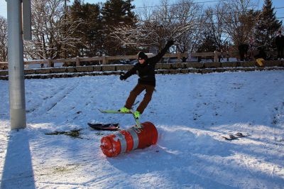 Ski Jumps
Tabor Academy sophomores Andrei Sarbu (yellow pants) and Joe Barry and friends enjoyed their Sunday afternoon, turning the little sledding slope on Spring Street at Tabor Academy’s soccer field into a ski jump. The two 16-year-olds took turns sticking landings from atop roadway barriers. Barry is from Falls Church, Virginia, and Sarbu is a native of Chico, California. Photos by Mick Colageo
