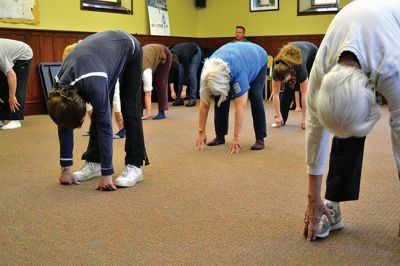 World Tai Chi and Qigong Day
A group in Mattapoisett joined others across the globe in celebrating World Tai Chi and Qigong Day on April 26 at 10:00 am, just as other groups did at 10:00 am in their local time zones. Led by Tai Chi Practitioner Colman Fink, 15 locals moved gracefully together with conscious breath in the downstairs of the Mattapoisett Free Library – thanks to the rain that dampened the plan to meet at Ned’s Point for a second year in a row. By Jean Perry
