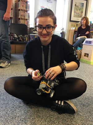 Robots
Old Colony student Bridgett Farias of Rochester demonstrates how a robot works during an introductory meeting sponsored by Plumb Library on May 17. Students in Grades 4 through 6 got to drive robots and learn more about the high school program. Photo by Marilou Newell
