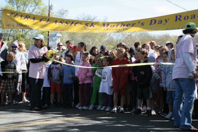 Mom's Running
Over 600 runners came to Mattapoisett on May 9, 2010 to celebrate mom in the fourth annual Tiara Classic 5K road race. This years race had more runners than ever, despite the wind and cold temperatures. The road race benefits the New Bedford Womens Fund, an organization that empowers and provides upward mobility to women. Photos by Anne OBrien-Kakley.
