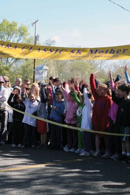 Mom's Running
Over 600 runners came to Mattapoisett on May 9, 2010 to celebrate mom in the fourth annual Tiara Classic 5K road race. This years race had more runners than ever, despite the wind and cold temperatures. The road race benefits the New Bedford Womens Fund, an organization that empowers and provides upward mobility to women. Photos by Anne OBrien-Kakley.
