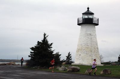 Mother’s Day Tiara 5k
Sunday’s wind and rain wasn’t stopping the hundreds who participated in the annual Mother’s Day Tiara 5k in Mattapoisett on May 10.  The storm brought strong wind and cold rain to the area, especially at the turn around Ned’s Point Lighthouse, dampening the day but not the sentiment behind the Women’s Fund of Southeastern Massachusetts’ largest annual fundraising event. Photos by Jean Perry

