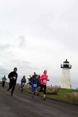 Mother’s Day Tiara 5k
Sunday’s wind and rain wasn’t stopping the hundreds who participated in the annual Mother’s Day Tiara 5k in Mattapoisett on May 10.  The storm brought strong wind and cold rain to the area, especially at the turn around Ned’s Point Lighthouse, dampening the day but not the sentiment behind the Women’s Fund of Southeastern Massachusetts’ largest annual fundraising event. Photos by Jean Perry
