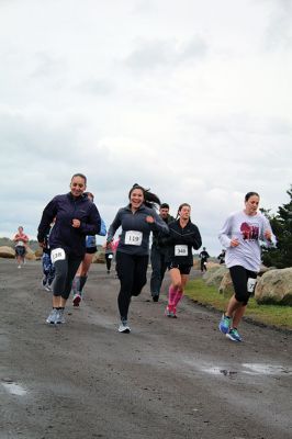 Mother’s Day Tiara 5k
Sunday’s wind and rain wasn’t stopping the hundreds who participated in the annual Mother’s Day Tiara 5k in Mattapoisett on May 10.  The storm brought strong wind and cold rain to the area, especially at the turn around Ned’s Point Lighthouse, dampening the day but not the sentiment behind the Women’s Fund of Southeastern Massachusetts’ largest annual fundraising event. Photos by Jean Perry
