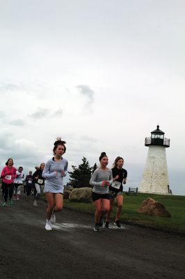 Mother’s Day Tiara 5k
Sunday’s wind and rain wasn’t stopping the hundreds who participated in the annual Mother’s Day Tiara 5k in Mattapoisett on May 10.  The storm brought strong wind and cold rain to the area, especially at the turn around Ned’s Point Lighthouse, dampening the day but not the sentiment behind the Women’s Fund of Southeastern Massachusetts’ largest annual fundraising event. Photos by Jean Perry
