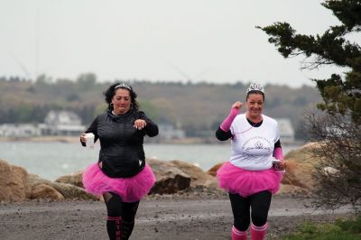 Mother’s Day Tiara 5k
Sunday’s wind and rain wasn’t stopping the hundreds who participated in the annual Mother’s Day Tiara 5k in Mattapoisett on May 10.  The storm brought strong wind and cold rain to the area, especially at the turn around Ned’s Point Lighthouse, dampening the day but not the sentiment behind the Women’s Fund of Southeastern Massachusetts’ largest annual fundraising event. Photos by Jean Perry
