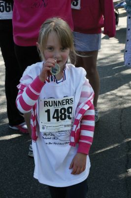 Mom's Running
Over 600 runners came to Mattapoisett on May 9, 2010 to celebrate mom in the fourth annual Tiara Classic 5K road race. This years race had more runners than ever, despite the wind and cold temperatures. The road race benefits the New Bedford Womens Fund, an organization that empowers and provides upward mobility to women. Photos by Anne OBrien-Kakley.
