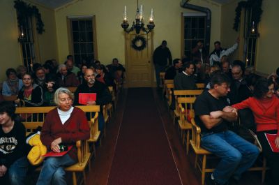 Tinkhamtown Chapel 
Carolers gathered at Tinkhamtown Chapel in Mattapoisett on the evening of December 17, 2011, to evoke the Christmas spirit. Revelers enjoyed old holiday song favorites and warmth from a potbelly stove. Photo by Felix Perez.
