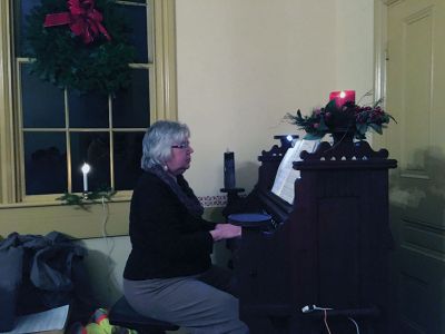 Tinkhamtown Chapel 
The lights from within the tiny Tinkhamtown Chapel spilled out into the cold dark on December 21, the longest eve of the year, for the annual Christmas carol sing-along. The warm and merry event has been held each year just before Christmas for nearly 70 years now. Photos by Marilou Newell
