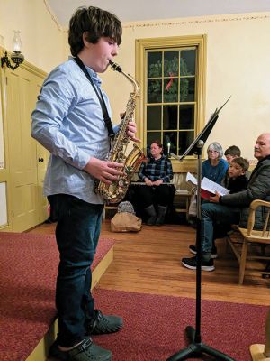 Tinkhamtown Chapel Singalong
Jack Bell plays the saxophone solo, and local children sing "Jingle Bells" and "The Twelve Days Before Christmas" during Saturday's annual Tinkhamtown Chapel Singalong. Photos courtesy Robert Price
