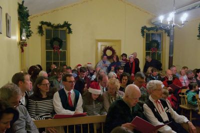 Tinkhamtown Chapel
The annual Christmas carol sing-along at the Tinkhamtown Chapel was as popular and beautiful as ever on the chilly evening of December 20, when dozens of people followed the glow of candlelit windows to the tiny chapel to sing with their families and neighbors and welcome Christmas to Mattapoisett. Photos by Colin Veitch
