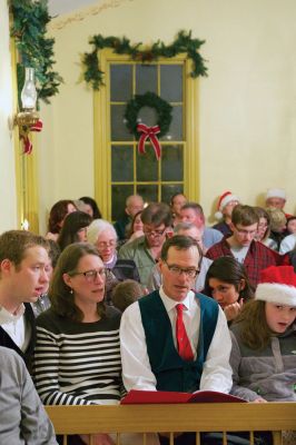 Tinkhamtown Chapel
The annual Christmas carol sing-along at the Tinkhamtown Chapel was as popular and beautiful as ever on the chilly evening of December 20, when dozens of people followed the glow of candlelit windows to the tiny chapel to sing with their families and neighbors and welcome Christmas to Mattapoisett. Photos by Colin Veitch
