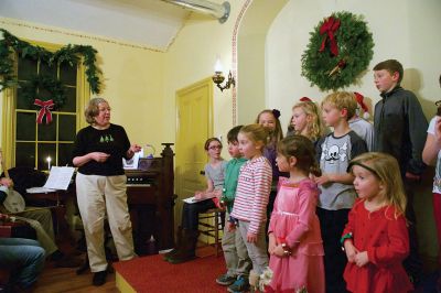 Tinkhamtown Chapel
The annual Christmas carol sing-along at the Tinkhamtown Chapel was as popular and beautiful as ever on the chilly evening of December 20, when dozens of people followed the glow of candlelit windows to the tiny chapel to sing with their families and neighbors and welcome Christmas to Mattapoisett. Photos by Colin Veitch
