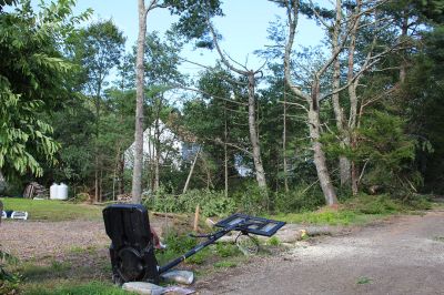 Tornado in Mattapoisett
An EF-1 tornado touched down late Tuesday morning in Mattapoisett. The unusual weather event downed power lines and hundreds of trees, knocking out power to many homes north of Route 195. Television news crews descended from Boston, as the Mattapoisett Fire and Police departments worked with utility companies and many power lines to clean up roads and assist area residents coming home to frightening scenes. Photo by Mick Colageo
