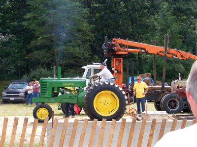 Tractor Pull
Leo Oullette, of Rochester, rides his John Deere Tractor at the Tractor Pull.
