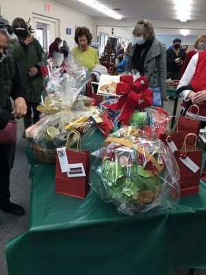 Festival of Trees 
The Festival of Trees opened on November 27 with a reception at the Cushing Community Center on Route 6 in Marion. Sponsored by the Friends of Marion Council on Aging, the event showcased 14 decorated Christmas trees, along with an artisan sale, music, refreshments and a raffle for over 10 gift baskets. For more information about the Festival of Trees, call Karen Gregory at 508-748-3570. Photos by Mick Colageo and Marilou Newell

