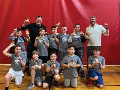 Tri-Town Basketball 
March 12 was the final night for the Tri-Town Basketball playoffs. The league had over 190 participants in grades 3-6 representing Mattapoisett, Marion and Rochester. The boys grade 5-6 champions were the Bulls, and the boys grade 3-4 champions were the Raptors. Heat coach David Arancio talks to his team. The girls champions were the Sparks. Photos courtesy Gerta Fox
