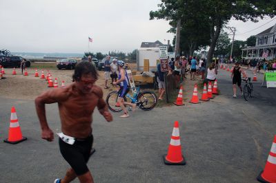 Mattapoisett Lions Club Triathlon
Emily Tato was grateful to Aner Larreategi after their top-three-overall performances in Sunday’s Mattapoisett Lions Club Triathlon. Pushed from start to finish by Larreategi, Tato was the fastest woman in all three events, the swim, bike and run. Don Cuddy was the 70-and-over winner. Photos by Mick Colageo
