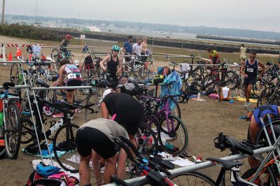 Mattapoisett Lions Club Triathlon
Emily Tato was grateful to Aner Larreategi after their top-three-overall performances in Sunday’s Mattapoisett Lions Club Triathlon. Pushed from start to finish by Larreategi, Tato was the fastest woman in all three events, the swim, bike and run. Don Cuddy was the 70-and-over winner. Photos by Mick Colageo
