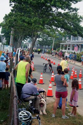 Mattapoisett Lions Club Triathlon
Emily Tato was grateful to Aner Larreategi after their top-three-overall performances in Sunday’s Mattapoisett Lions Club Triathlon. Pushed from start to finish by Larreategi, Tato was the fastest woman in all three events, the swim, bike and run. Don Cuddy was the 70-and-over winner. Photos by Mick Colageo
