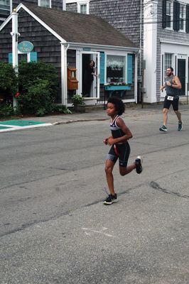 Mattapoisett Lions Club Triathlon
Emily Tato was grateful to Aner Larreategi after their top-three-overall performances in Sunday’s Mattapoisett Lions Club Triathlon. Pushed from start to finish by Larreategi, Tato was the fastest woman in all three events, the swim, bike and run. Don Cuddy was the 70-and-over winner. Photos by Mick Colageo
