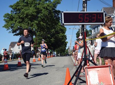  Kicking Off
It’s official! Harbor Days in Mattapoisett has begun, starting on Sunday, July 9, with the annual Triathlon. Following events are Wednesday with Concert in the Park and strawberry shortcake, Thursday is Paint Night at Shipyard Park, Friday is the fish fry, Saturday is craft fair/vendors, entertainment, U-Pick ‘Em Auction, and lobster dinner, and Sunday is the pancake breakfast. Photos by Glenn C. Silva
