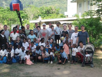 Trinidad Orphanage Mission
Eighteen ORR students and one Tabor student, along with their fathers, spent their April vacation working at an orphanage on the island of Trinidad. The group provided labor, materials, and good spirits to help paint the sleeping areas for the 35 children who live at the Christ Child Convalescence Home. “It was a very eye-opening experience,” said Ben Mattson, who went with his father, Wayne. “The kids were very excited to have us visit. 
